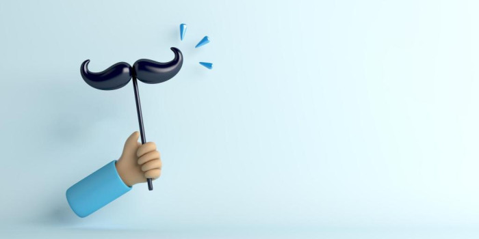 hand holding Prostatecancer awareness moustache on stick 